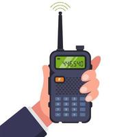 man-holds-walkie-talkie-in-hand-for-communication-vector-(1).jpg